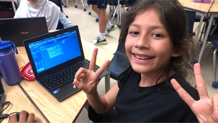 A student smiling while learning