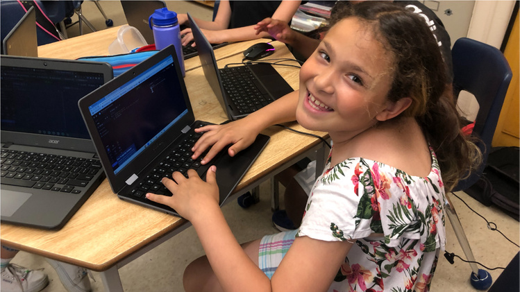 Happy student learning to code