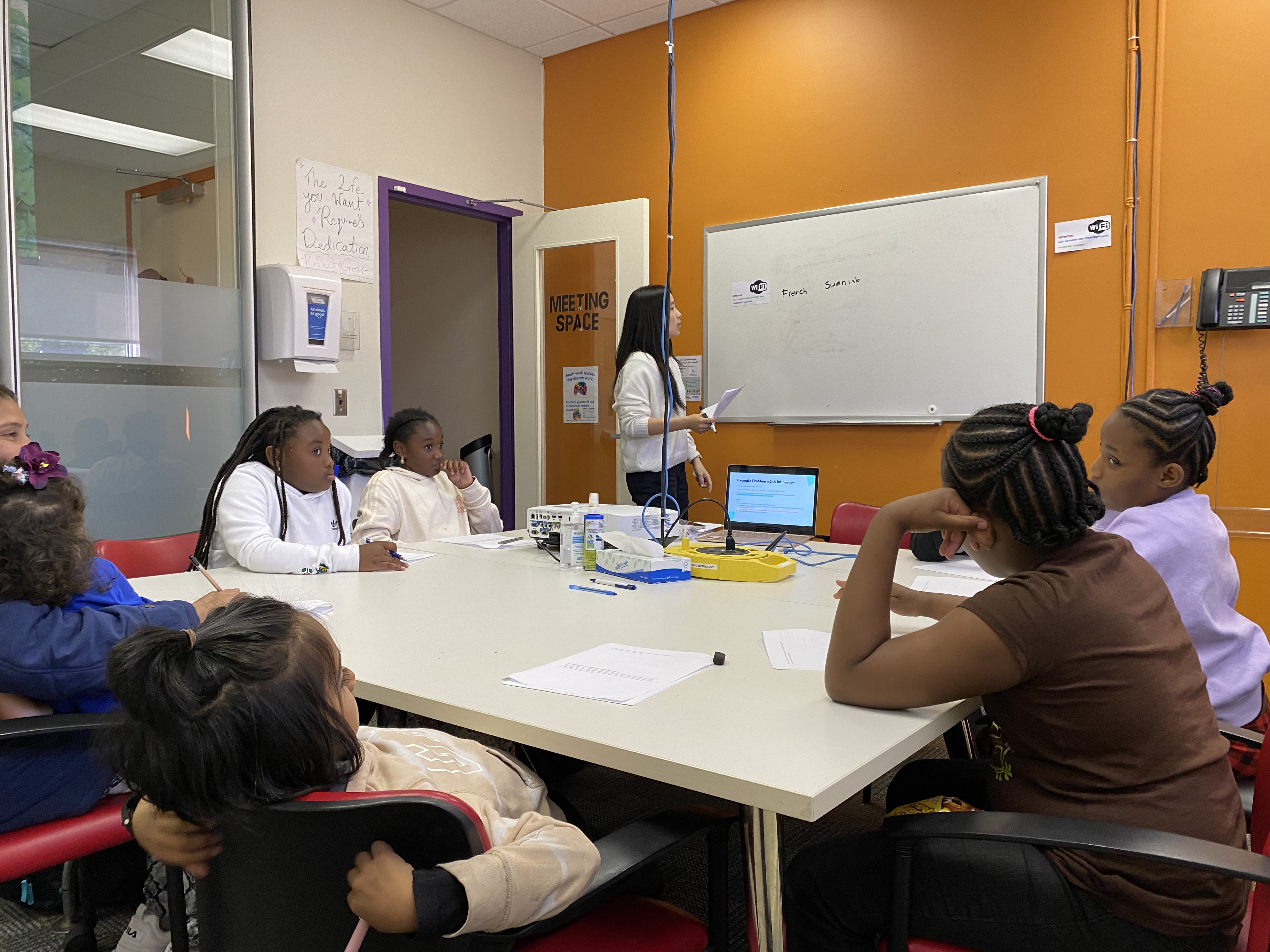 Student mentor teaching younger students